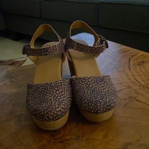 Black and tan platform clogs